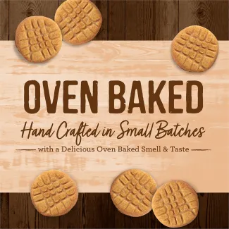 Oven Baked Paw’some Peanut Butter circular dog treats with a tan background that says “Oven baked hand crafted in small batches with a delicious oven baked smell &amp; taste.” 
